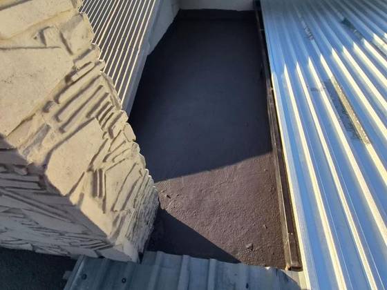 A flat roof finished with a seamless liquid rubber membrane